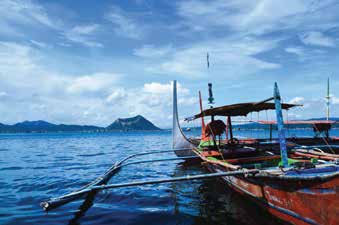 Outrigger boats on bright blue water
